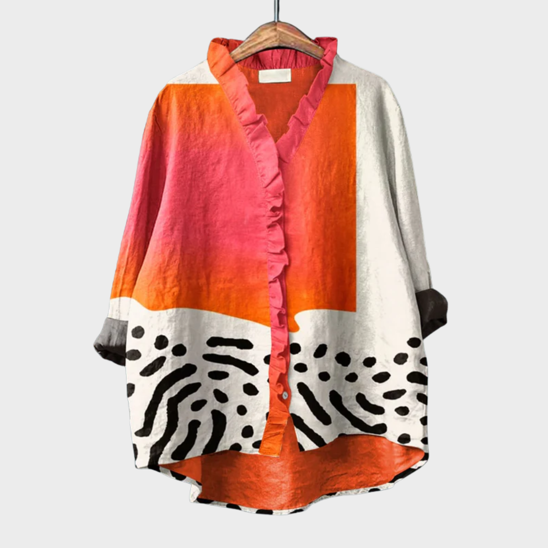 Blouse Garance multicolore à motifs abstraits, encolure volantée et boutons.