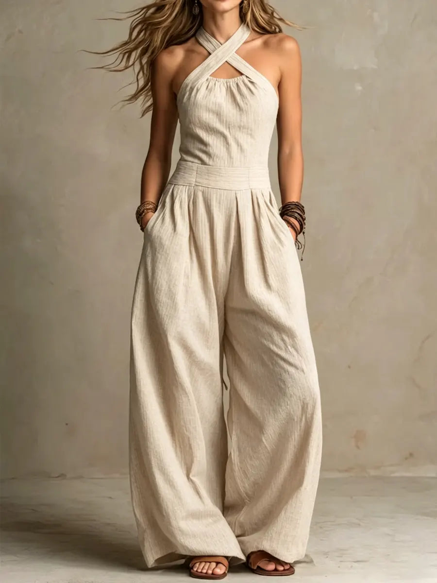 Combinaison ample en lin et coton beige, bretelles croisées, jambes larges.