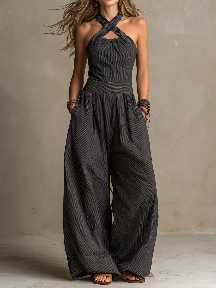 Combinaison ample en lin et coton noire, encolure croisée dos nu, jambes larges.