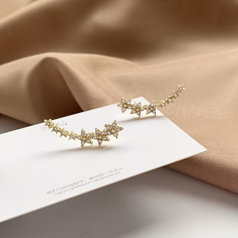 Boucles d’oreilles florales en or jaune, motifs en rangée de fleurs sur petit support