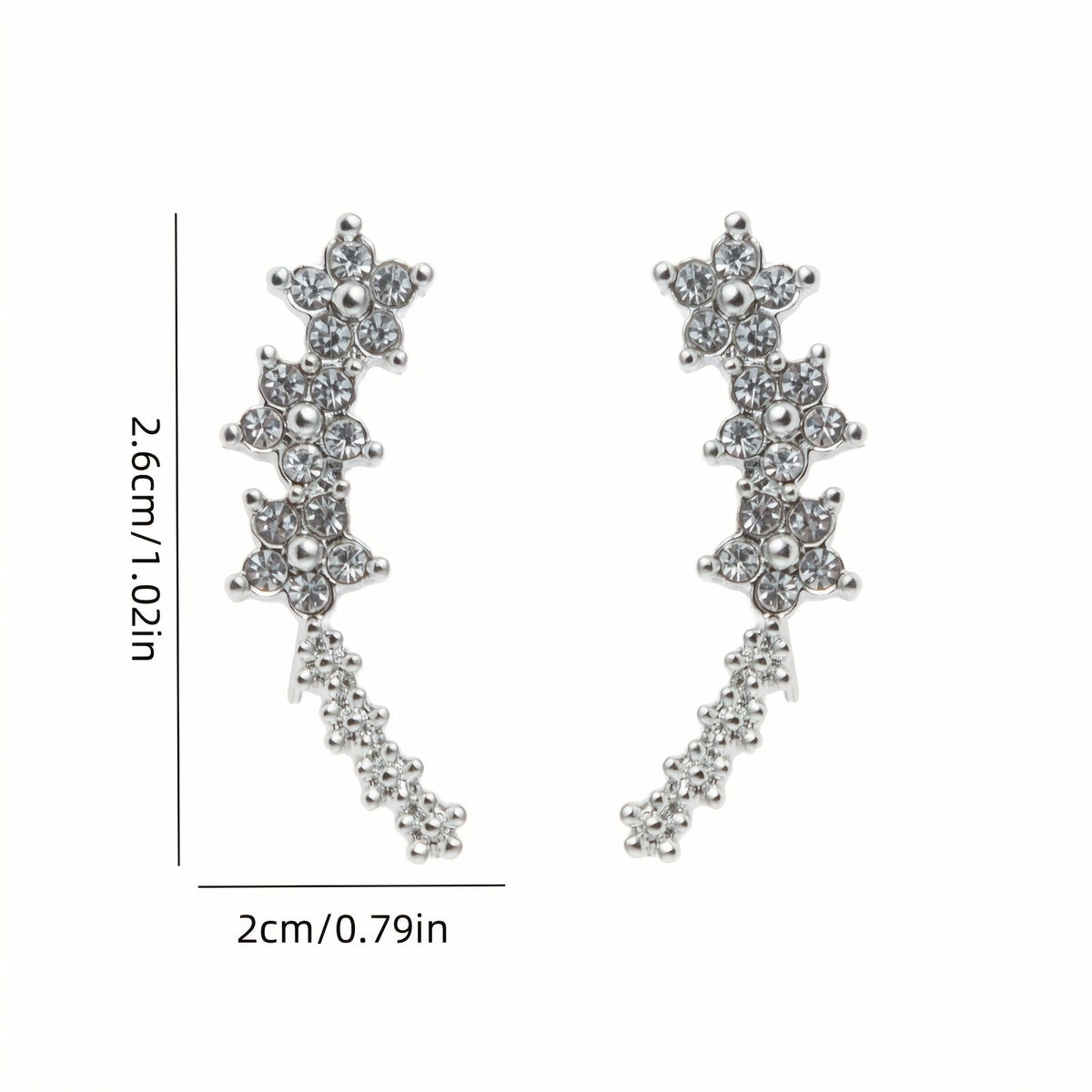 Boucles d’oreilles fleurs en strass blanc, dimensions visibles, longue forme en V.