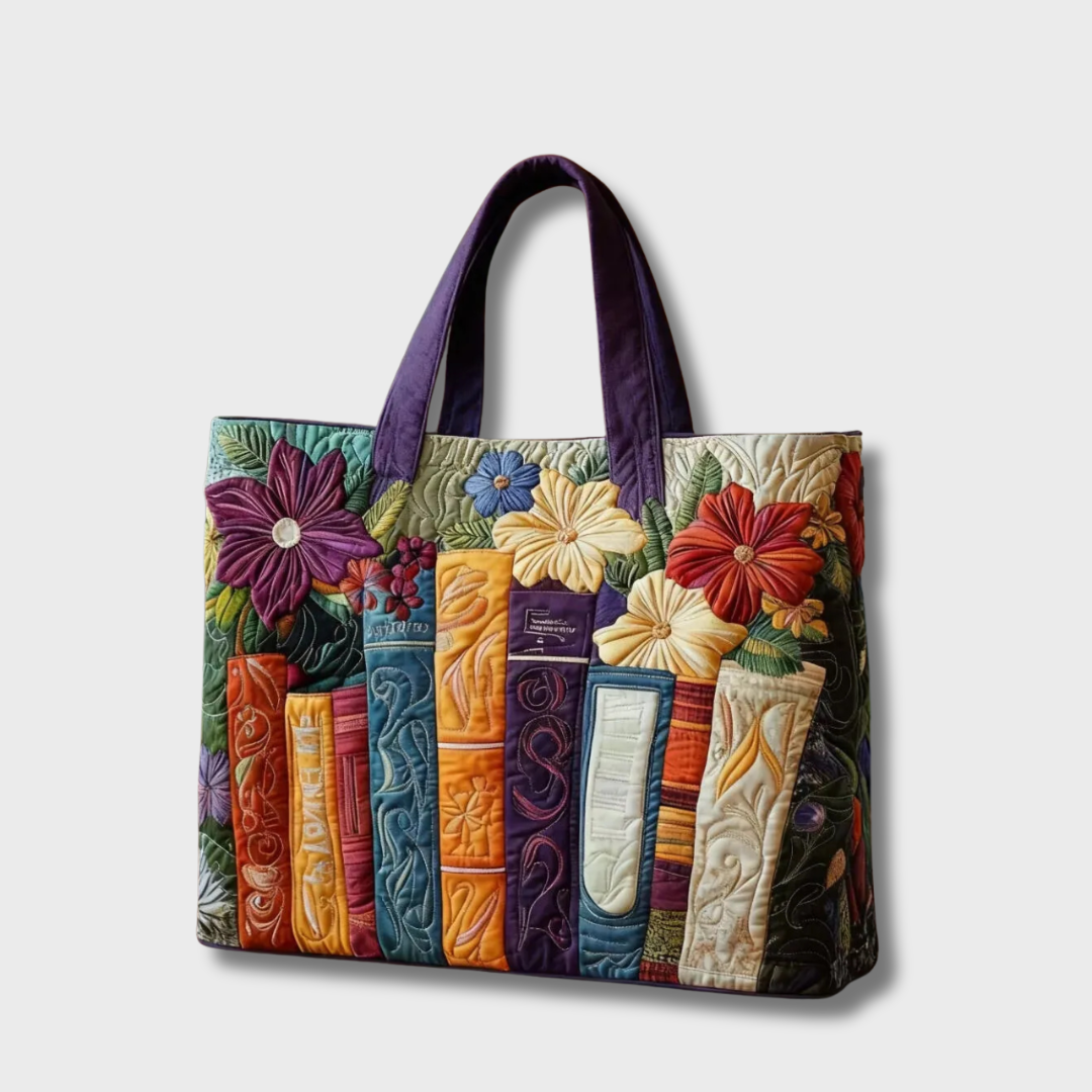Sac cabas patchwork multicolore à fleurs, anses violettes, poche verticale.