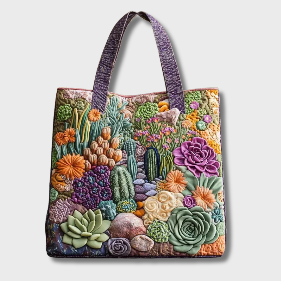 Sac tote matelassé fait main, anses violettes, motif fleurs colorées et cactus.