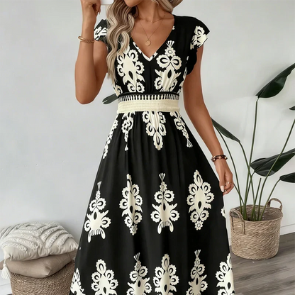 Robe longue col en V noire à manches volantées, imprimé baroque blanc et ceinture à la taille