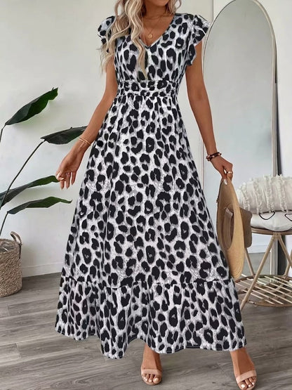 Robe longue col en V à motif léopard noir et blanc, manches volantées, jupe évasée