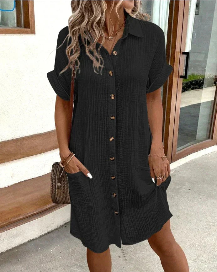 Robe polo oversize noire, col, manches courtes, boutonnage, poches latérales
