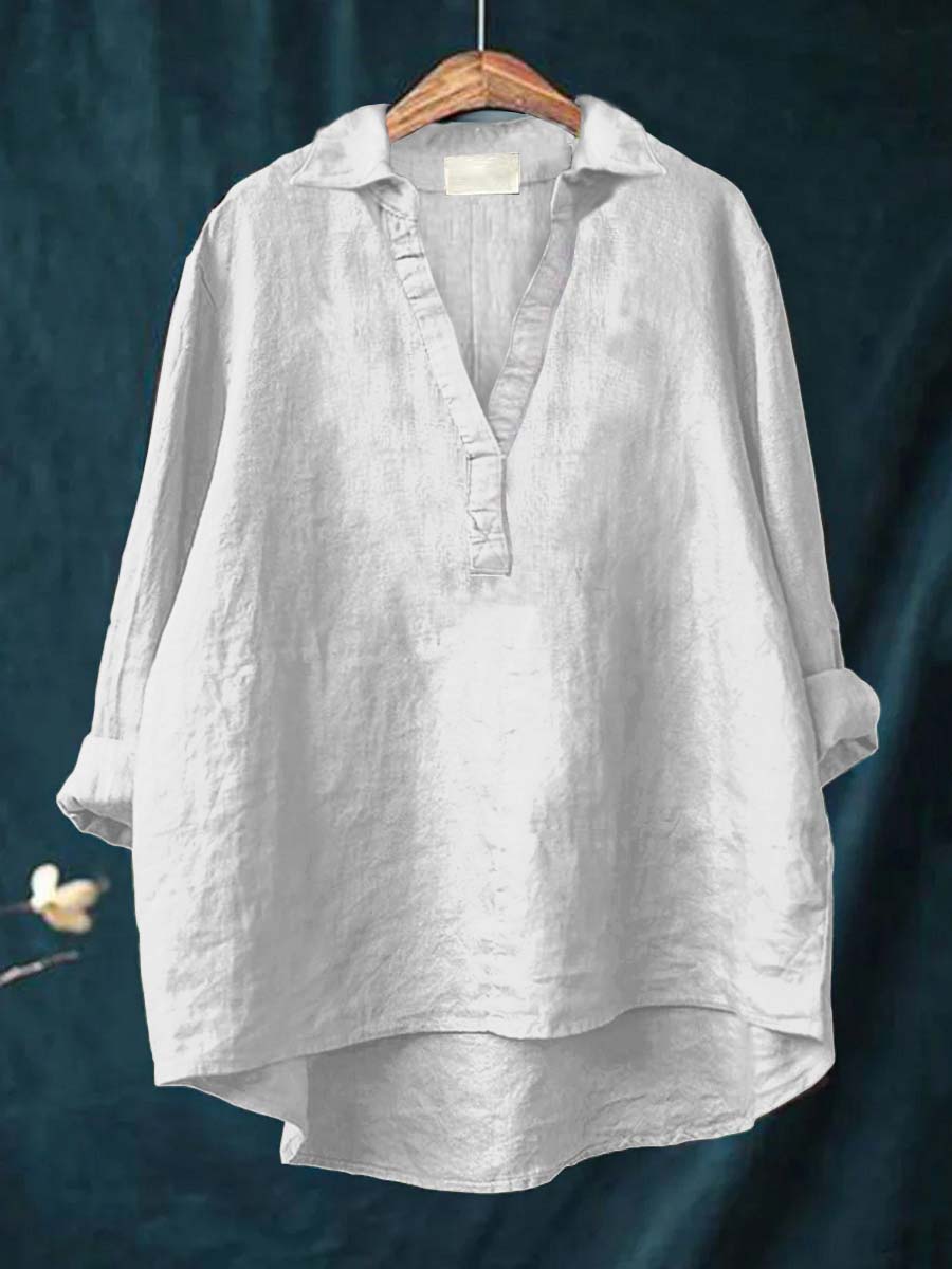 Chemisier en lin blanc à encolure V, patte boutonnée, manches amples