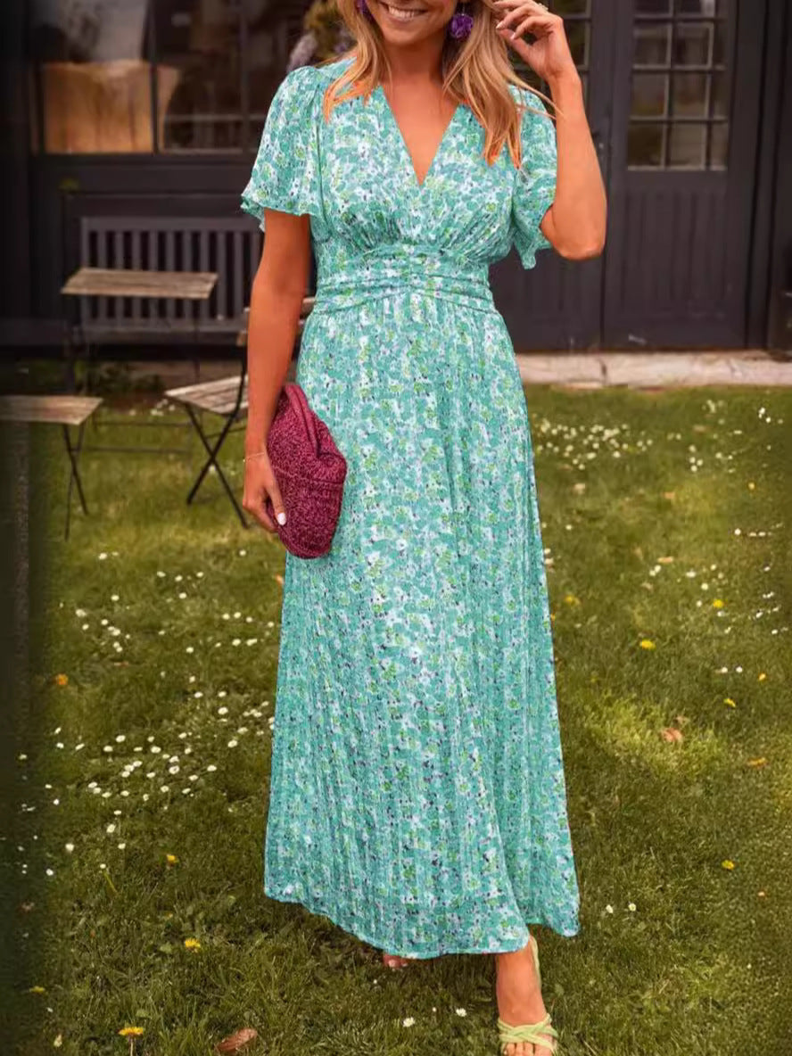 Robe longue fluide fleurie verte, encolure V, manches courtes, taille marquée