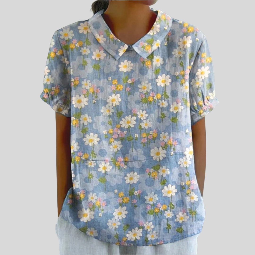 Blouse légère bleue à col chemise, manches courtes, imprimé fleurs marguerites