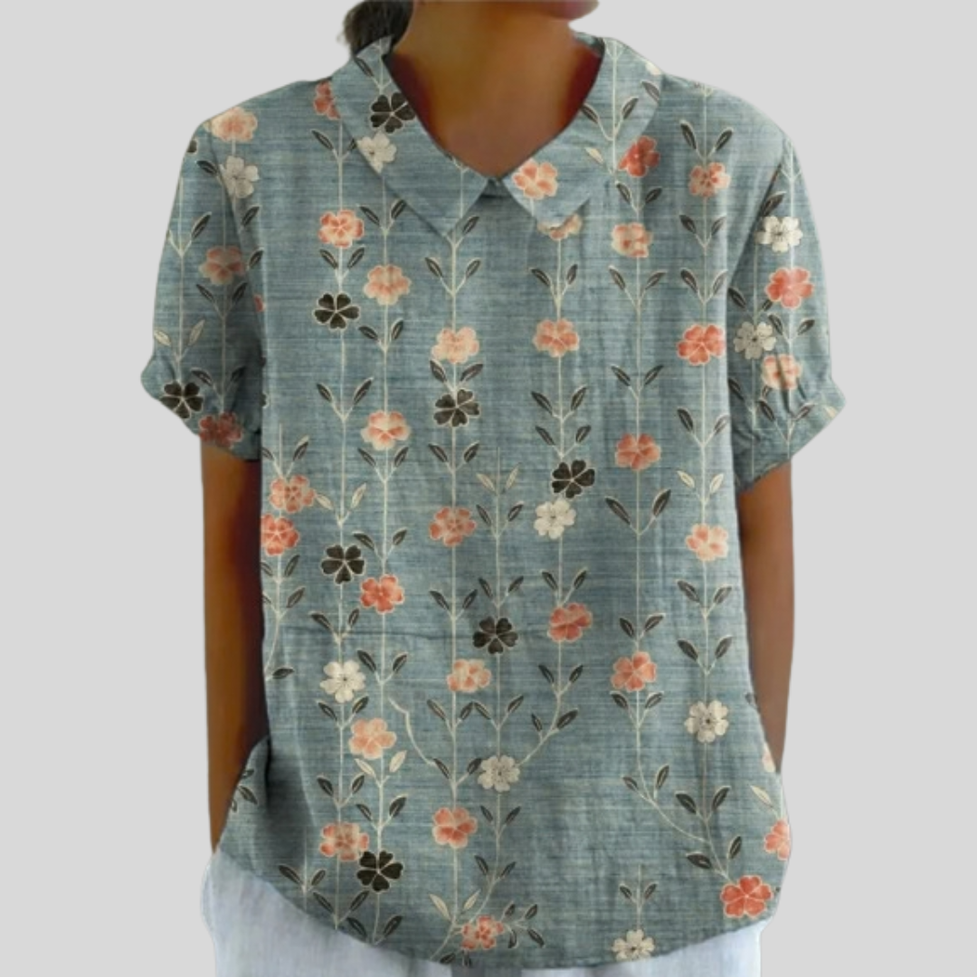 Blouse Élora à encolure en V, manches courtes, fleurs alignées sur fond bleu-vert