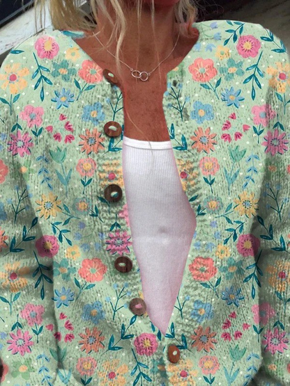 Gilet Foxfield™ fleuri vintage turquoise, encolure en V, boutons marron.