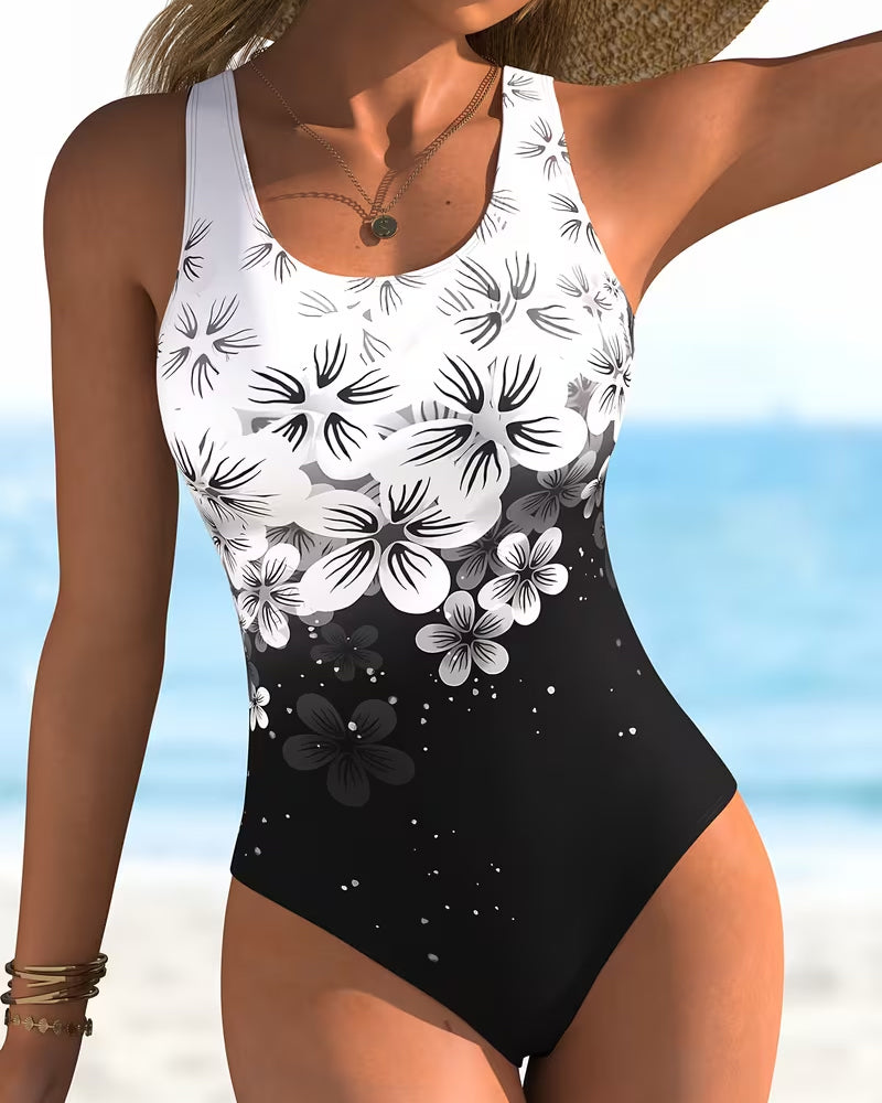 Combinaison une pièce noire à imprimé floral blanc, encolure ronde