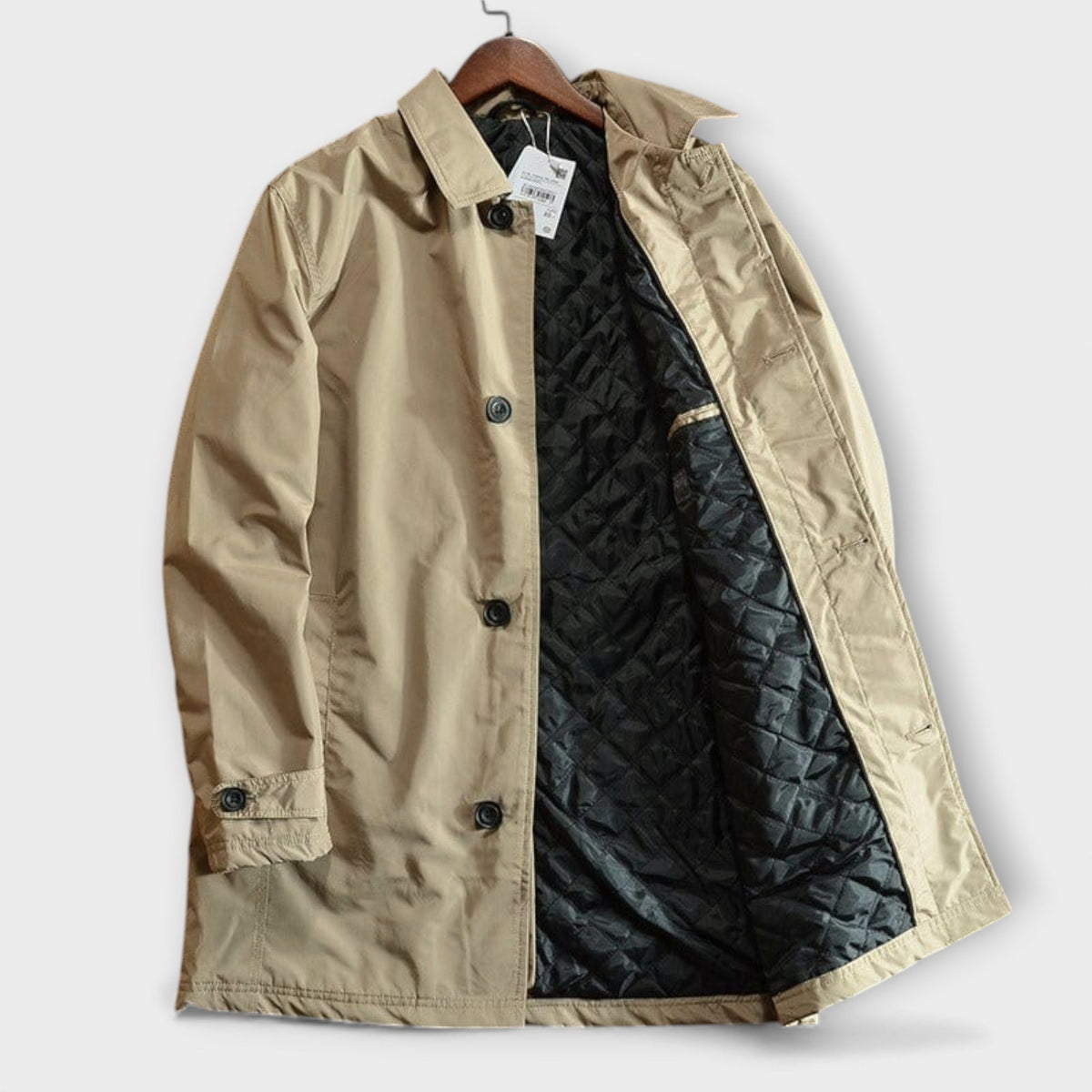 Trench-coat kaki sur cintre, ouverture avec boutons, doublure noire matelassée