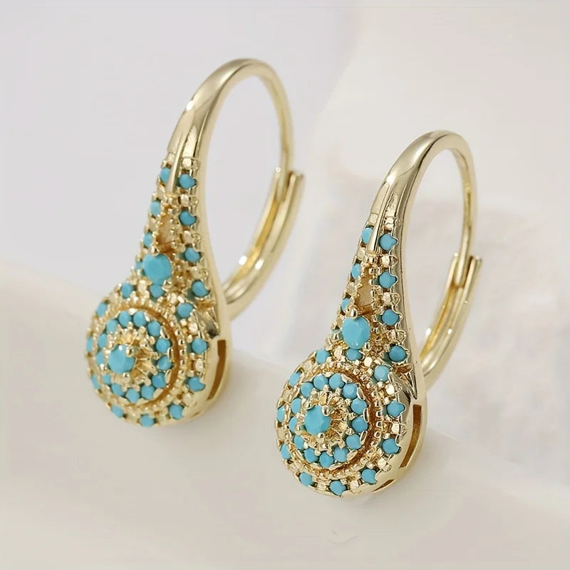 Boucles d’oreilles créoles dorées turquoise, motif floral et pastilles émaillées
