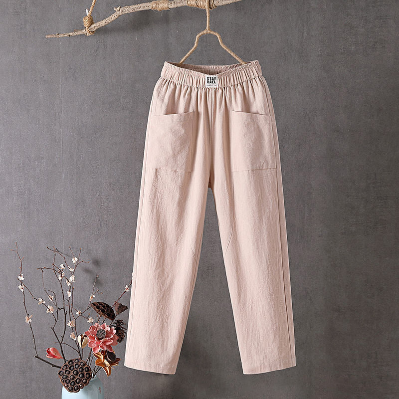 Pantalon ample rose pâle à taille élastique et poches plaquées