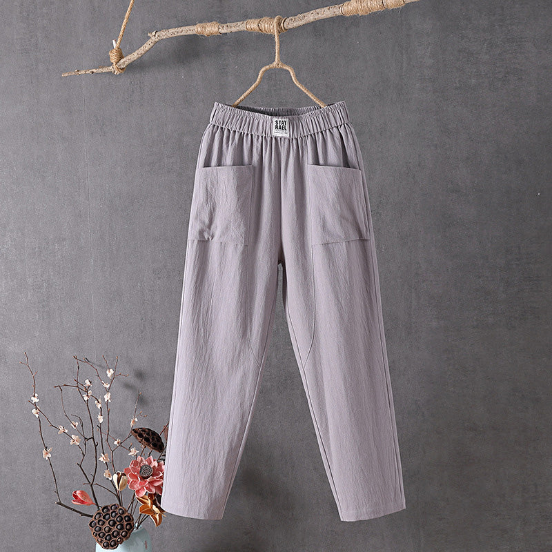 Pantalon ample gris clair à taille élastique et poches plaquées