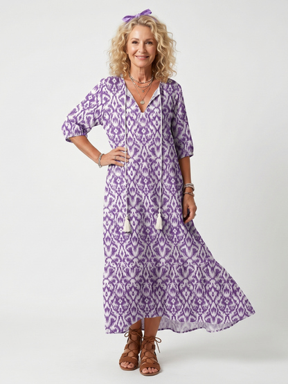 Robe midi violette imprimée, décolleté V avec liens, coupe évasée