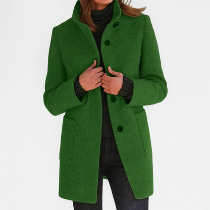 Manteau mi-long en laine vert à boutons, col montant et poches plaquées