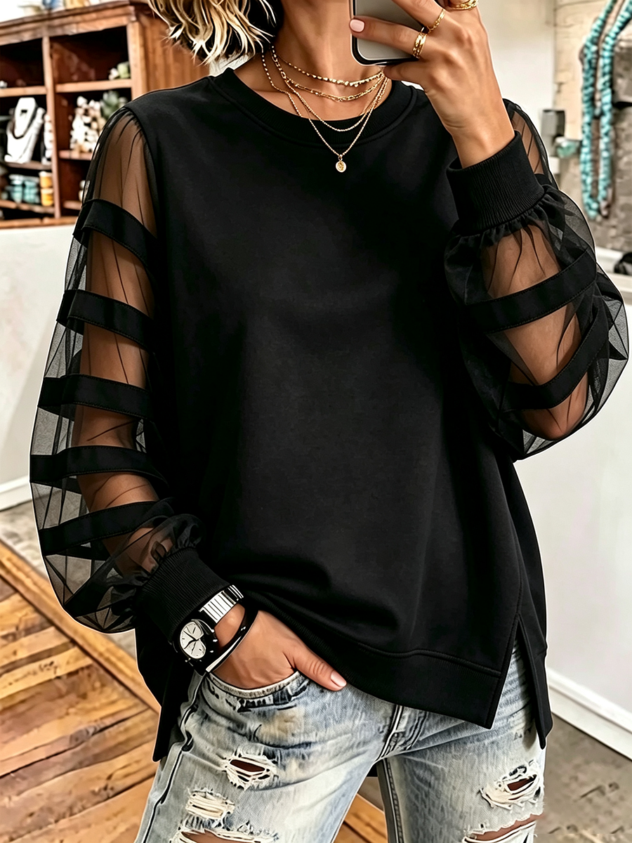 Pull noir en maille ample, manches en tulle transparentes à bandes, col rond