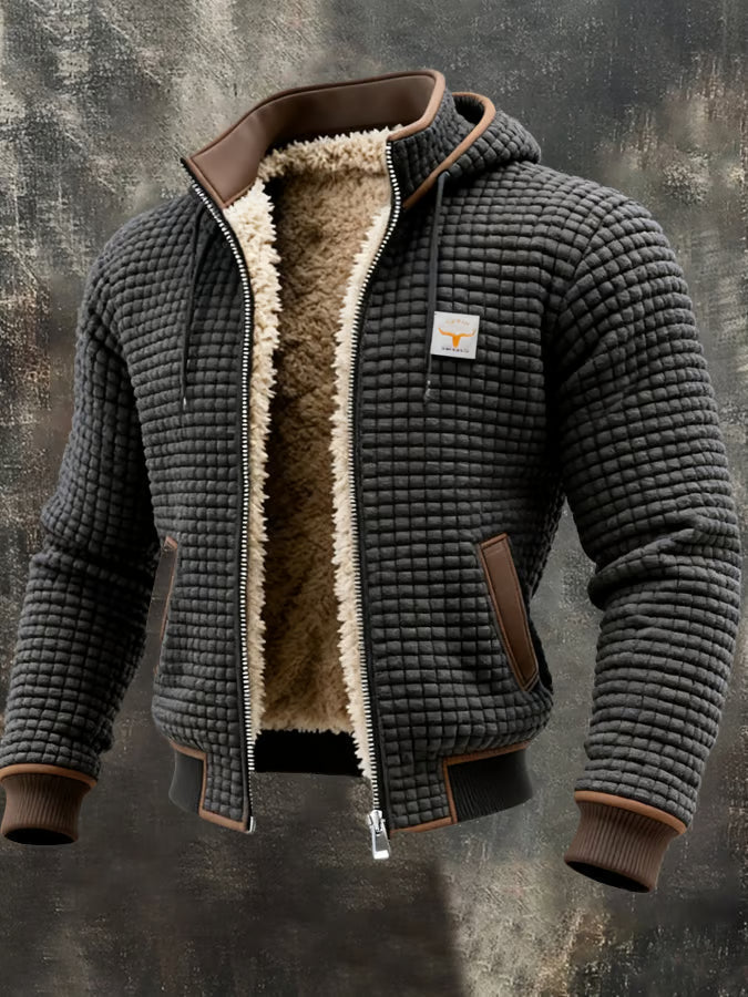Veste bomber homme grise à capuche, doublure sherpa chaude, texture gaufrée.