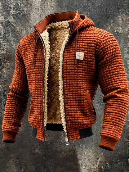 Veste bomber homme orange à capuche, doublure sherpa chaude, texture gaufrée.